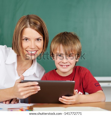 Teacher and student during lesson with tablet