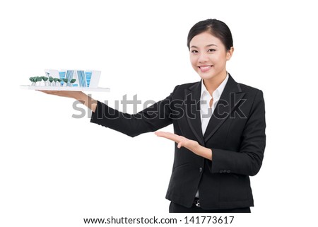Isolated portrait of a realtor with a house model in hands