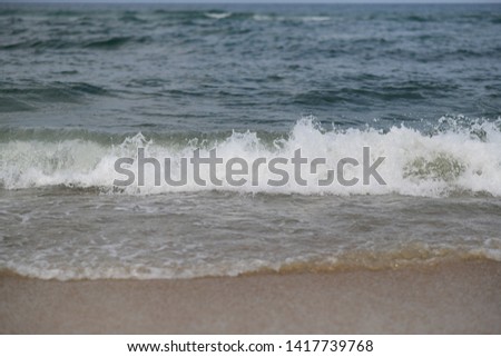 waves on a beach on a sunny summer day