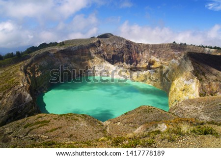 KELIMUTU VOLCANO WITH BLUE AND BROWN  WATER IN FLORES  ISLAND-INDONESIA 