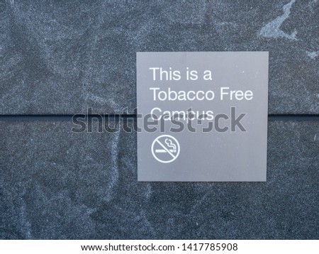 This is a tobacco free campus sign and logo posted outside of building