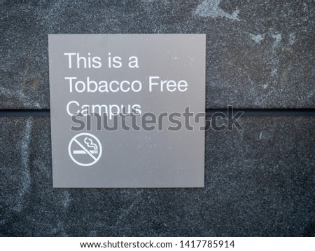 This is a tobacco free campus sign and logo posted outside of a building
