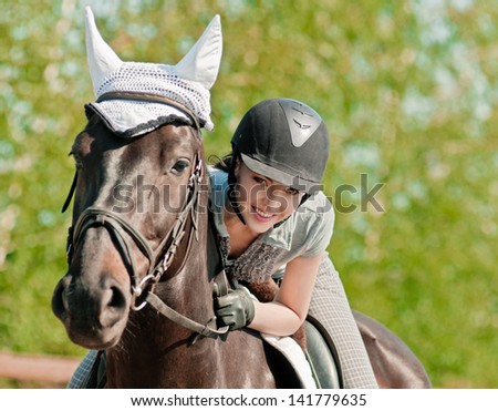 riding young woman on horse in outdoor Royalty-Free Stock Photo #141779635