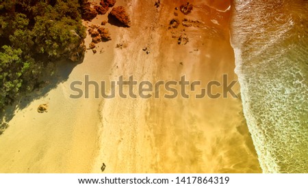 Aerial overhead view of Hot Water Beach and coastline, New Zealand.