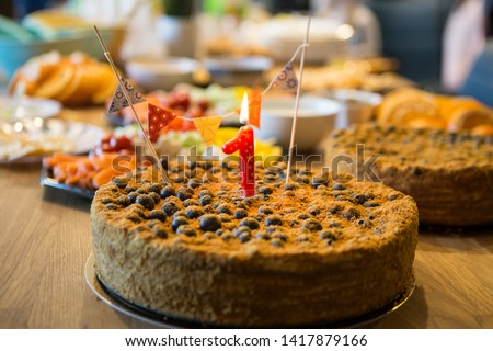 One year birthday cake with candle derocr