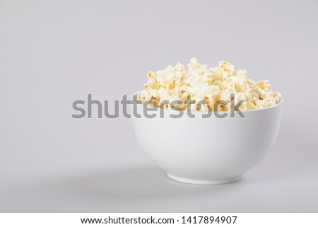 Popcorn bowl isolated on white, clipping path included. Royalty-Free Stock Photo #1417894907