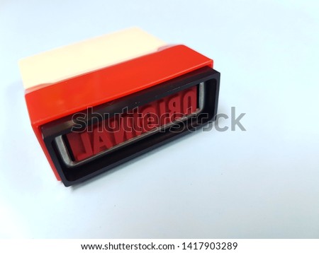 Rubber stamp with text "Original" on blue background with copy space. Office supply and stationary concept.
