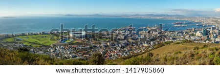 Amazing panoramic view of beautiful Cape Town from Signal Hill showing V&A waterfront, harbour sea point, soccer stadium, Green Point and Robben Island out to sea. Western Cape. South Africa