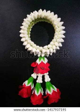 Thai form of floral garland with jasmine and rose flower in thailand, on Table