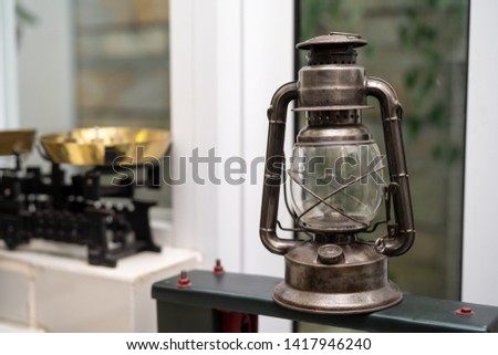 A single tradition kerosene lamp or paraffin lamp is on shelf in the antique lamp collection in vietnam, the original vietnam lamp in the past. Royalty high quality free photo image of Ancient.