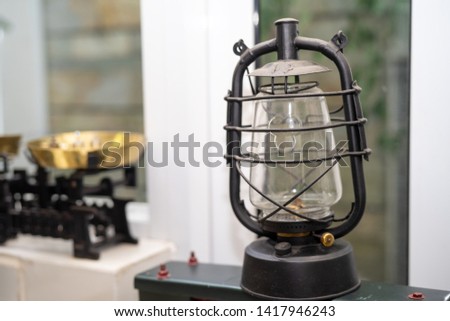 A single tradition kerosene lamp or paraffin lamp is on shelf in the antique lamp collection in vietnam, the original vietnam lamp in the past. Royalty high quality free stock image.