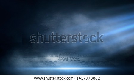 Dark empty scene, blue neon searchlight light, wet asphalt, smoke, night view, rays. Empty black studio room. Dark background. Abstract dark empty studio room texture.  Product showcase spotlight back