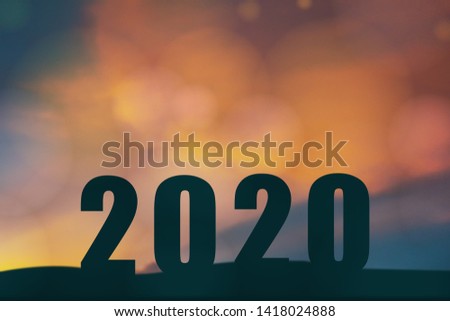 2020 happy new year concept, Silhouette of Number 2020 on the ground with sunset or sunrise background, 2020 the year of hope and technology , iot, 
