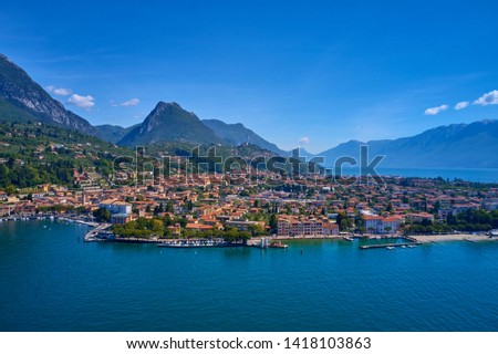 Flight on the drone, aerial view of the City of Maderno on Lake Garda, Italy.