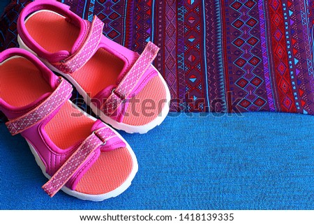 homemade pink grandma's slippers on a free and background, a place for an inscription on the background near bright comfortable shoes