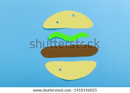 cartoon burger image on the blue background