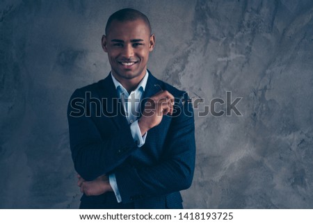 Close up photo portrait of attractive handsome smart clever intelligent nice in blue shirt lawyer real estate agent holding glasses for reading in hands isolated grey background