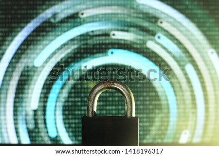 closed padlock in front of green matrix and circular lines background. cyber and computer security concept. privacy protection against hackers, virus and spyware. 