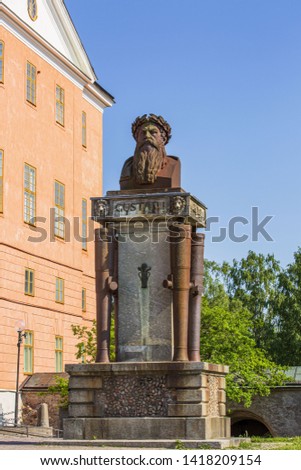 Beautiful view of old historical sculpture on blue sky background. Historical monuments concept. Europe. Sweden. Uppsala.