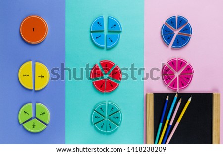 Colorful math fractions on the pink blue violet  bright backgrounds. Interesting math for kids. Education, back to school concept. Geometry and mathematics materials. Mental Math