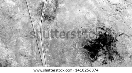trip to nowhere, black gold, polluted desert sand, black and white photo, abstract photography of the deserts of Africa from the air, aerial view, abstract expressionism, contemporary photographic art