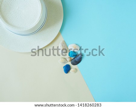 Concept of summer holidays with beach elements on a beige and blue background. The view from the top.Flat lay