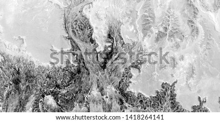 after the battle, black gold, polluted desert sand, black and white photo, abstract photography of the deserts of Africa from the air, aerial view, abstract expressionism, contemporary photo art