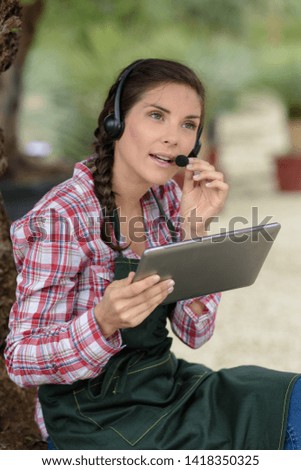 woman using tablets in the garden