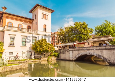 Cityscape of Portogruaro in Veneto Italy with lemene river, tower and panorama bridge