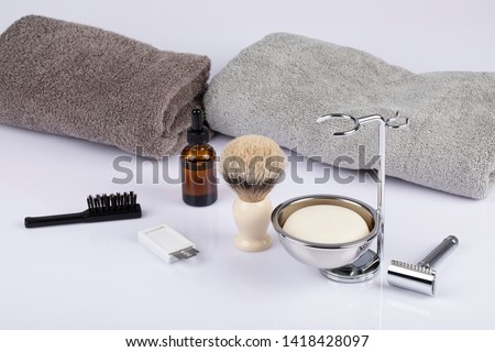 Traditional wet shaving. Shaving brush, safety razor, beard oil and soap. Royalty-Free Stock Photo #1418428097