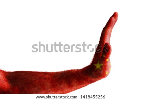 Male hand painted in the colors of the flag of China shows stop on white background