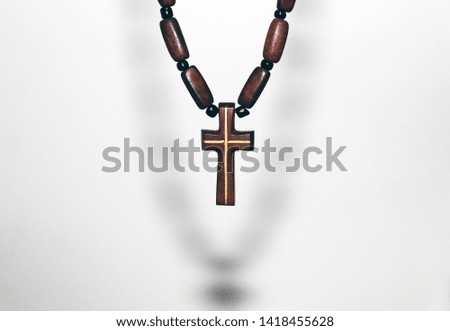 Wooden cross and chain background