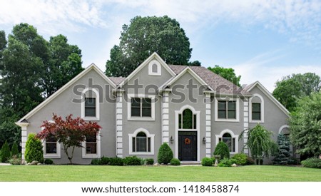 Beautiful Gray Stucco Luxury Home Royalty-Free Stock Photo #1418458874