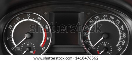 Close up to dashboard panel with tachometer and speedometer Royalty-Free Stock Photo #1418476562
