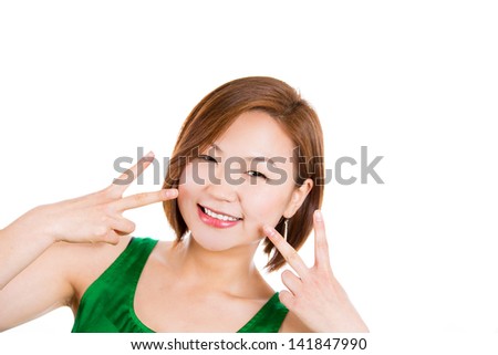 Beautiful woman giving a peace or victory sign, isolated on white background