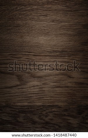 The dark brown wood background