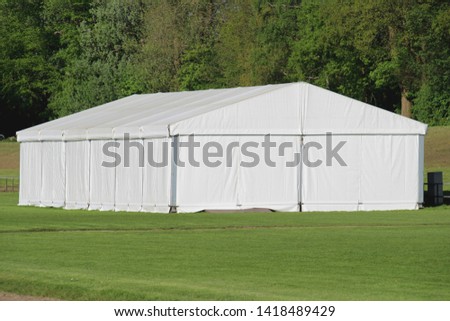 big white marquee tent outside Royalty-Free Stock Photo #1418489429