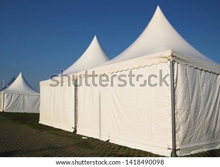 white pagoda marquee tent outside Royalty-Free Stock Photo #1418490098