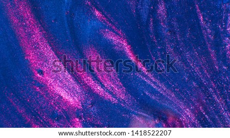 Abstract textured neon gradient blue and ultraviolet background transparent slime. Macro of kids toy slime.