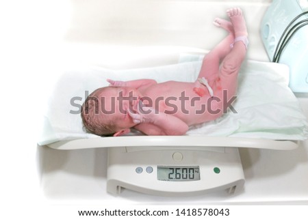 newborn baby weight measurement. In the neonatal department in the hospital