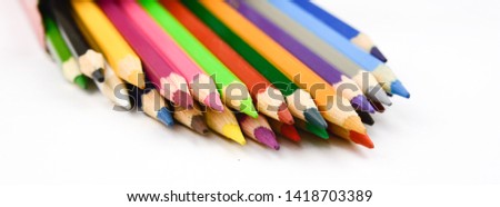 watercolor multicolored drawing pencils on white background.