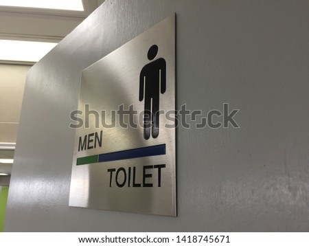 Men toilet sign on a toilet door