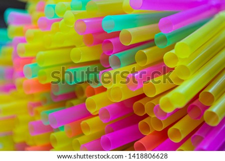 Colorful plastic straws drinking background