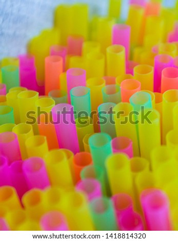Colorful plastic straws drinking background