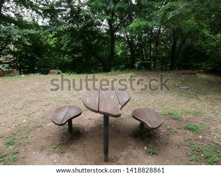 Small table and chairs in the park forest