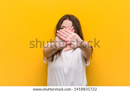 Young curvy plus size woman doing a denial gesture
