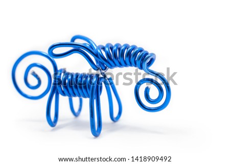 Selective focus picture of handmade Goat made by aluminium wire with isolate white background and copy space, close up background