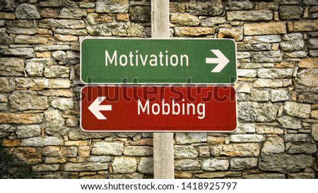 Street Sign the Direction Way to Motivation versus Mobbing