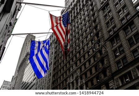 Greek and USA flag hanging in downtown district of Manhattan 