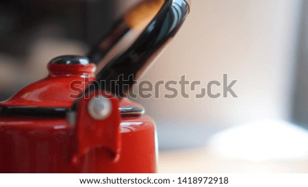 Close-up photo of vintage red kettle